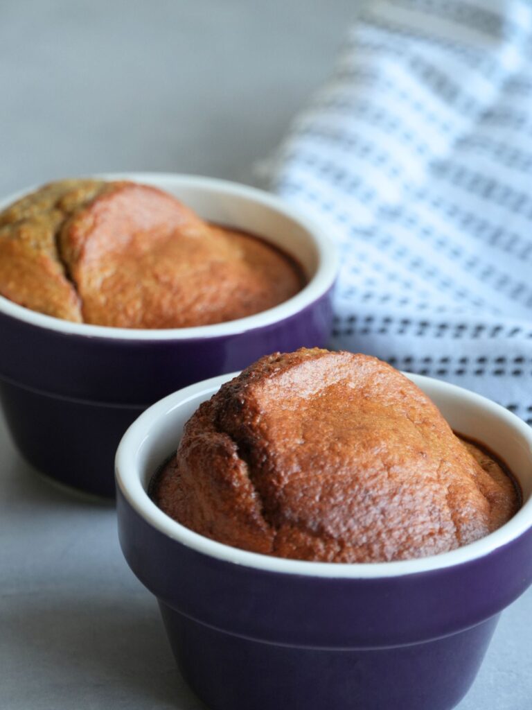 baked oats in purple ramekin bowls