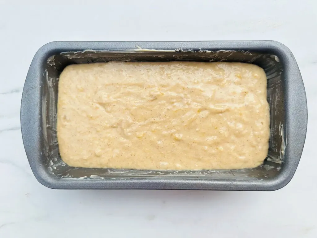 banana bread mixture in baking tin