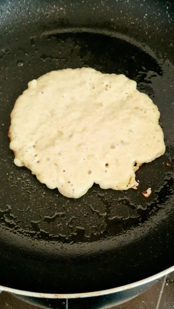 banana pancake batter in frying pan