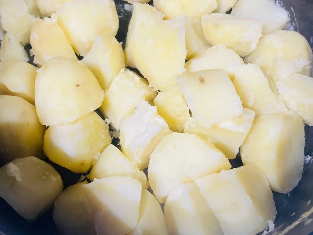bashing parboiled potatoes before roasting them 