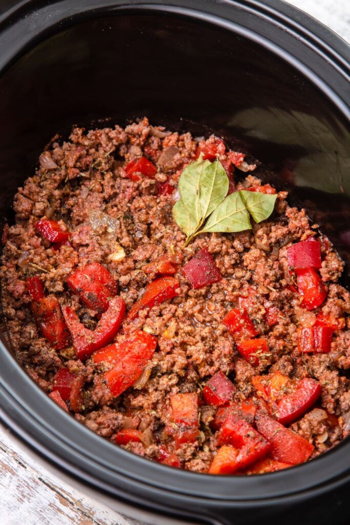 bolognese ingredients in slow cooker ready to be cooked