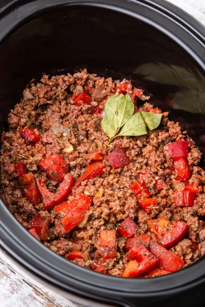 bolognese ingredients in slow cooker ready to be cooked