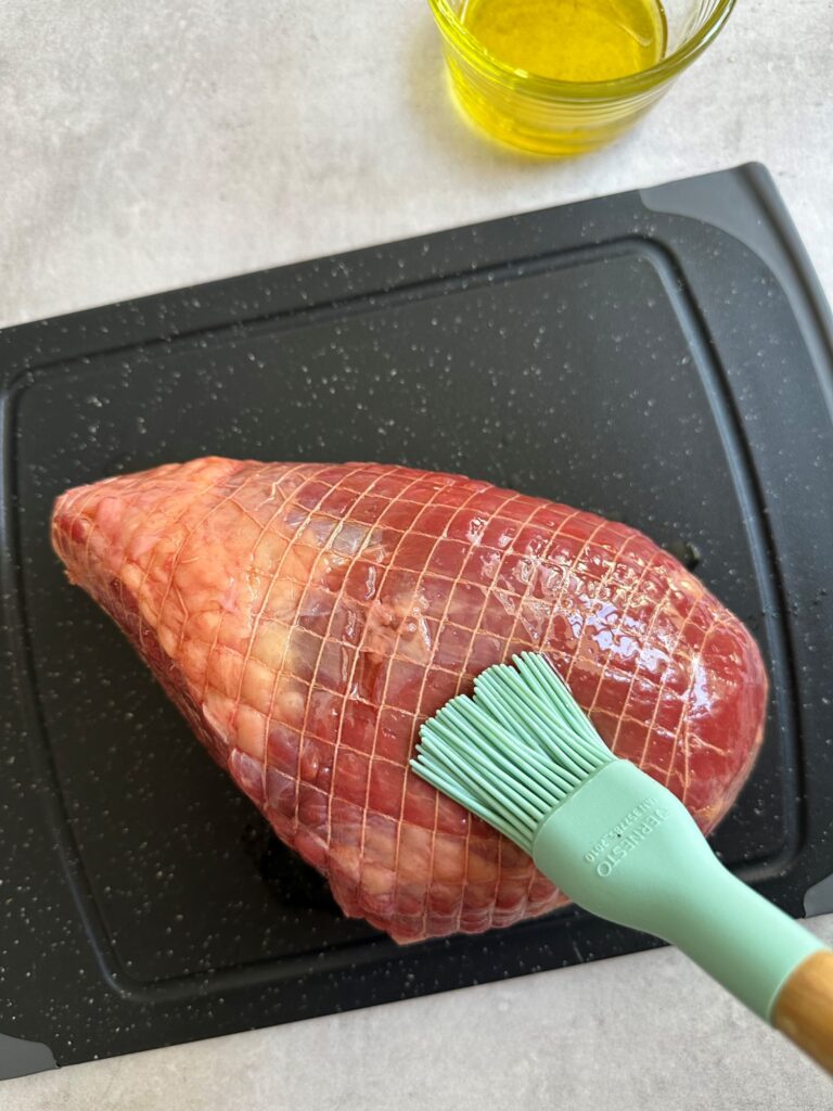 brushing raw beef with olive oil before adding it to the air fryer