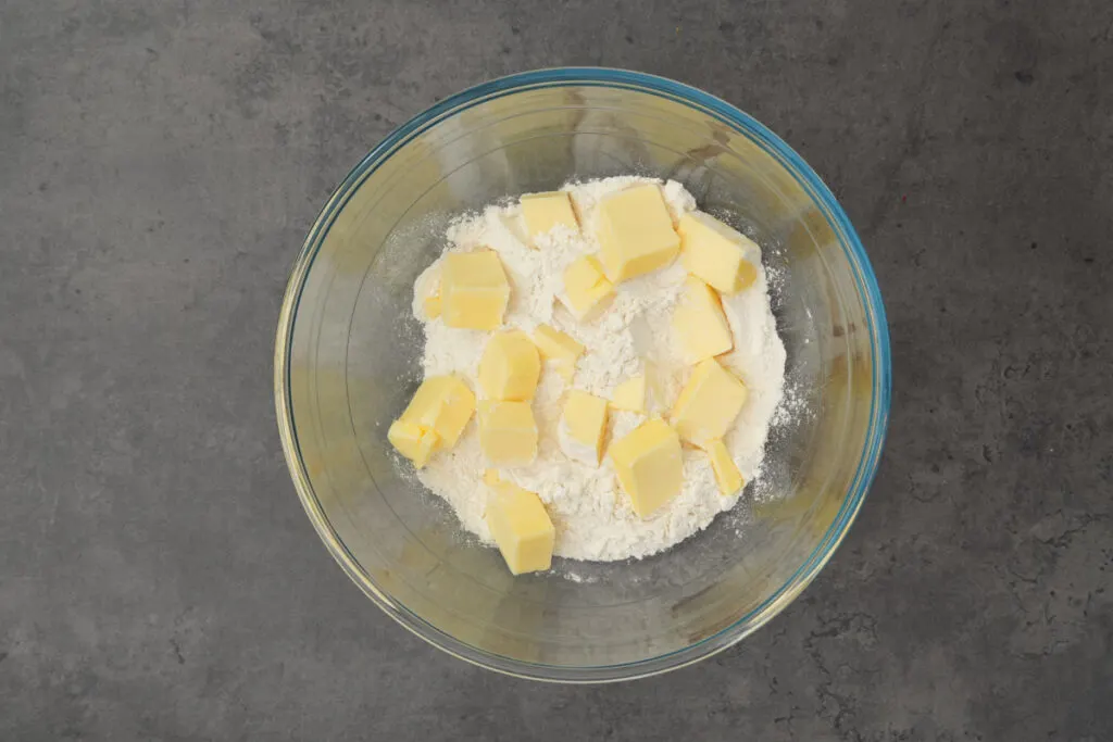 add butter cubes to flour