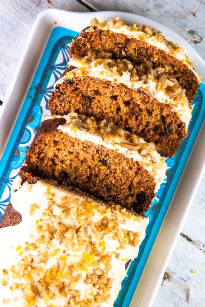 carrot cake loaf sliced on tray
