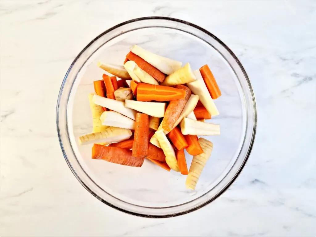 sliced carrots and parsnips in a bowl