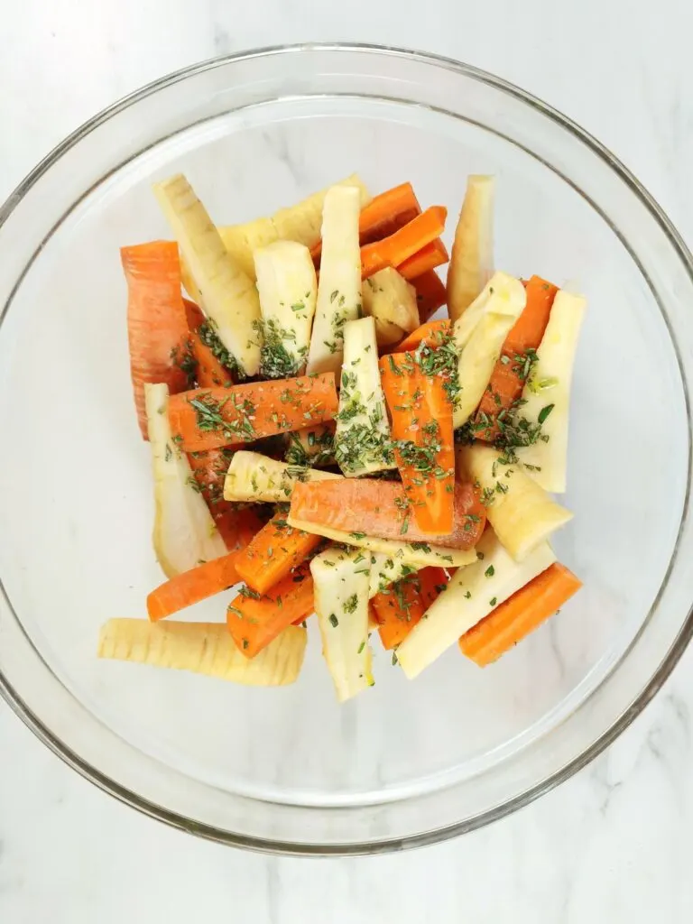 sprinkle fresh chopped rosemary on chopped carrots and parsnips