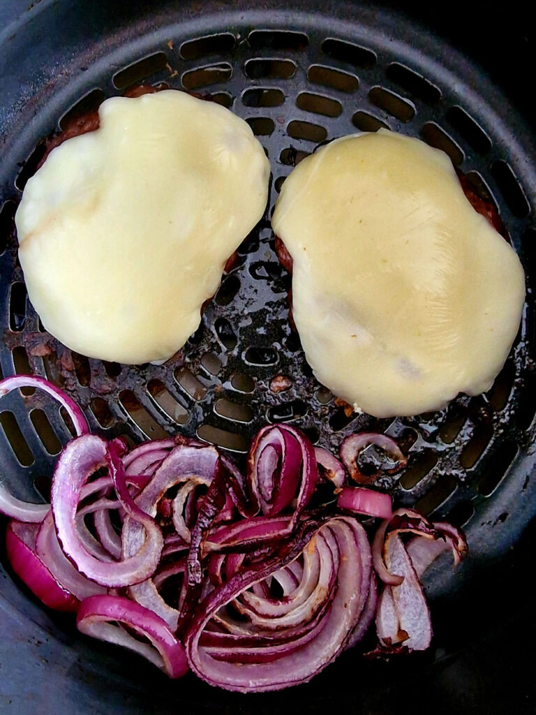 cheese melted over burgers with onions in air fryer
