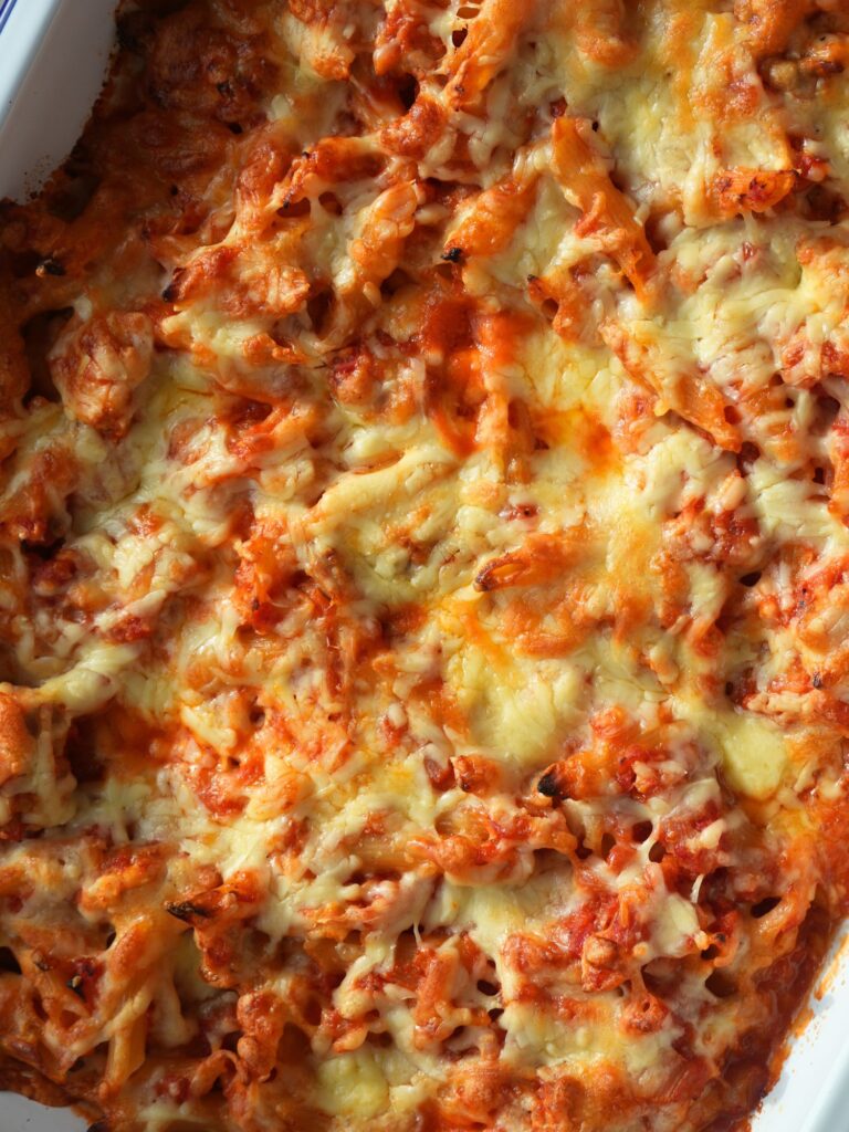 close up of cheesy chicken pasta bake