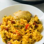 chicken chorizo rice and peppers in a white serving bowl