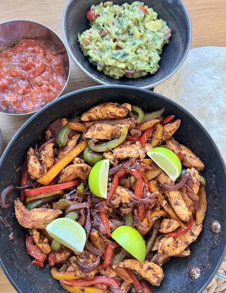 chicken fajitas mixture, guacamole and salsa