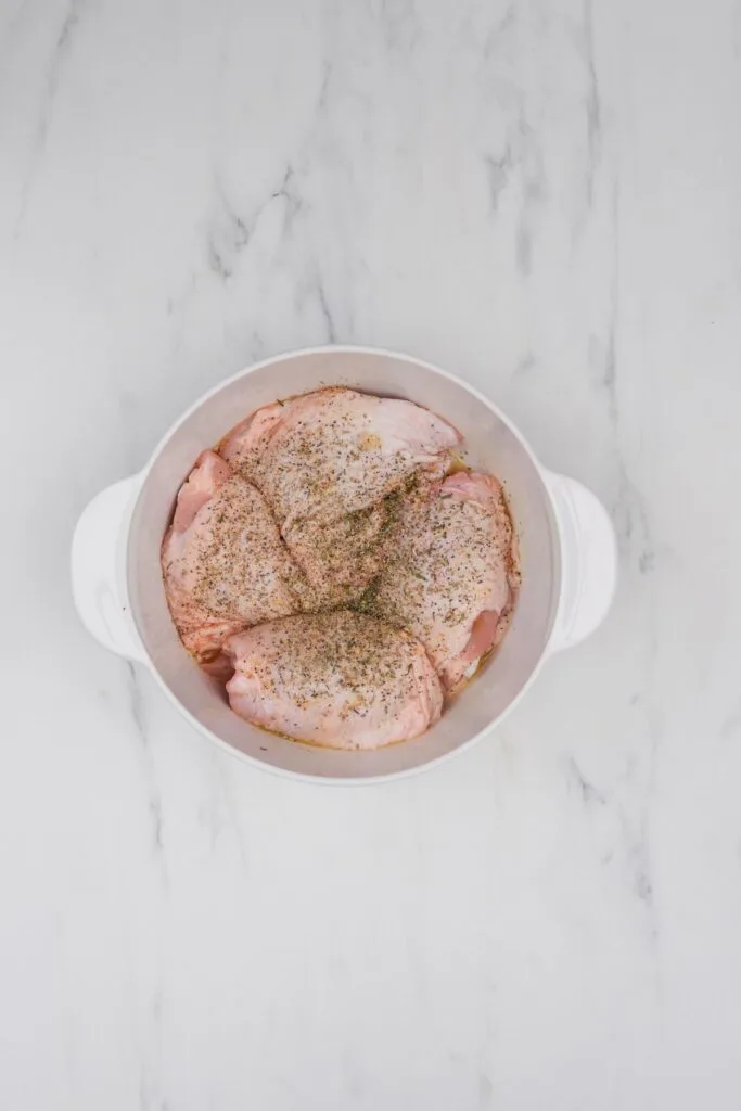 seasoned chicken thighs in a bowl