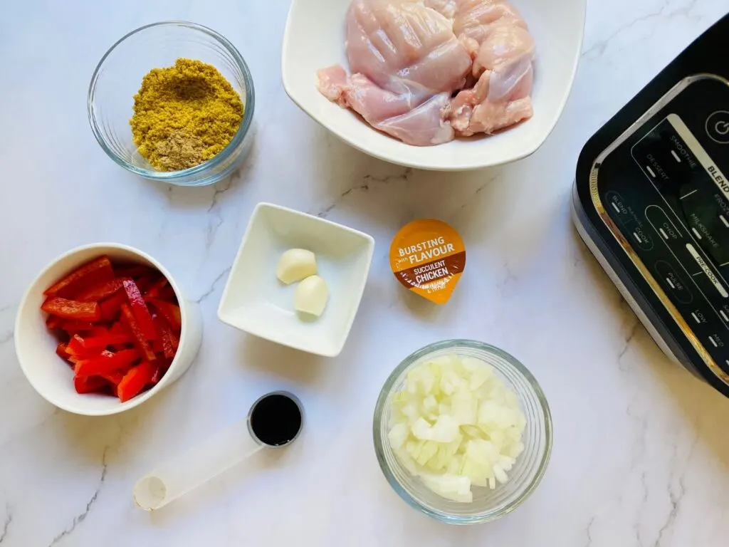 ingredients for a Chinese Chicken Curry Soup next to a Ninja Soup Maker