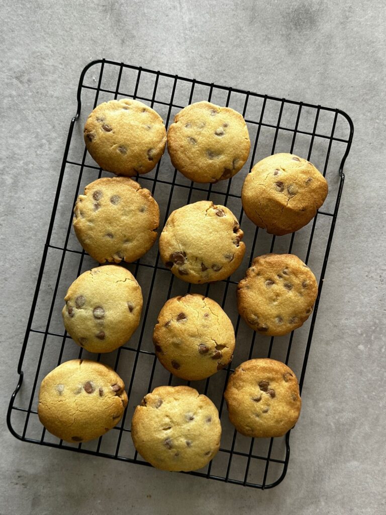 11 chocolate chip shortbread cookies on a wire rack cooling