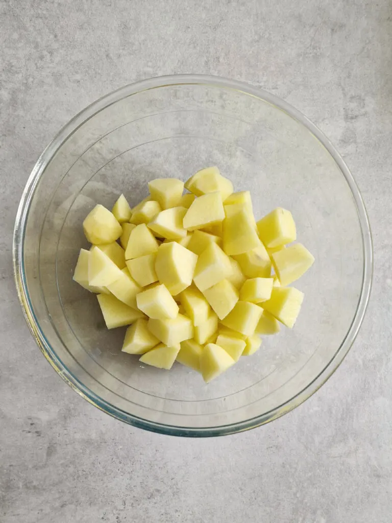 raw potato cubes in bowl