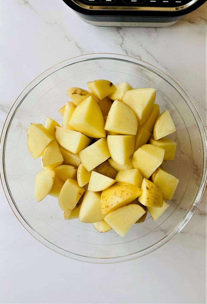 potatoes chopped up before going in the Ninja Soup Maker to make potato and garlic soup.