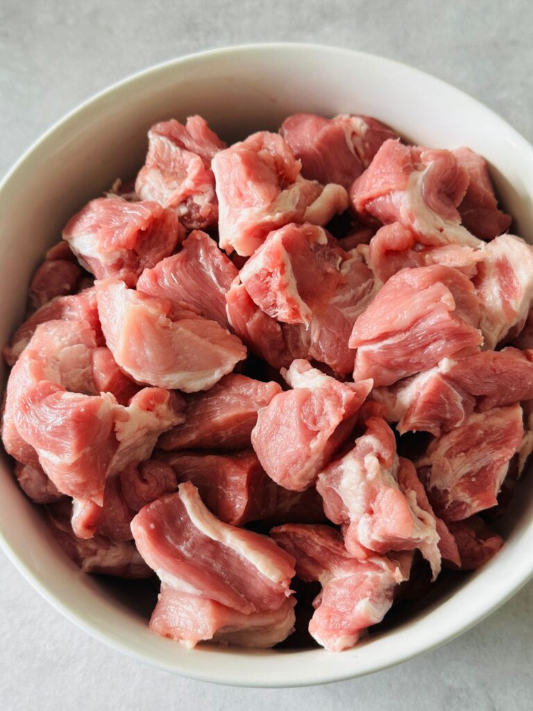 chopped pork shoulder in a white bowl