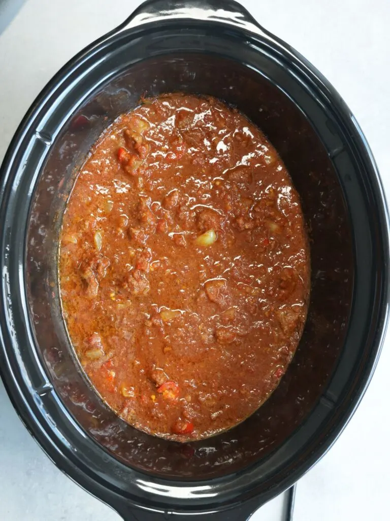 cooked beef curry in slow cooker, lid off
