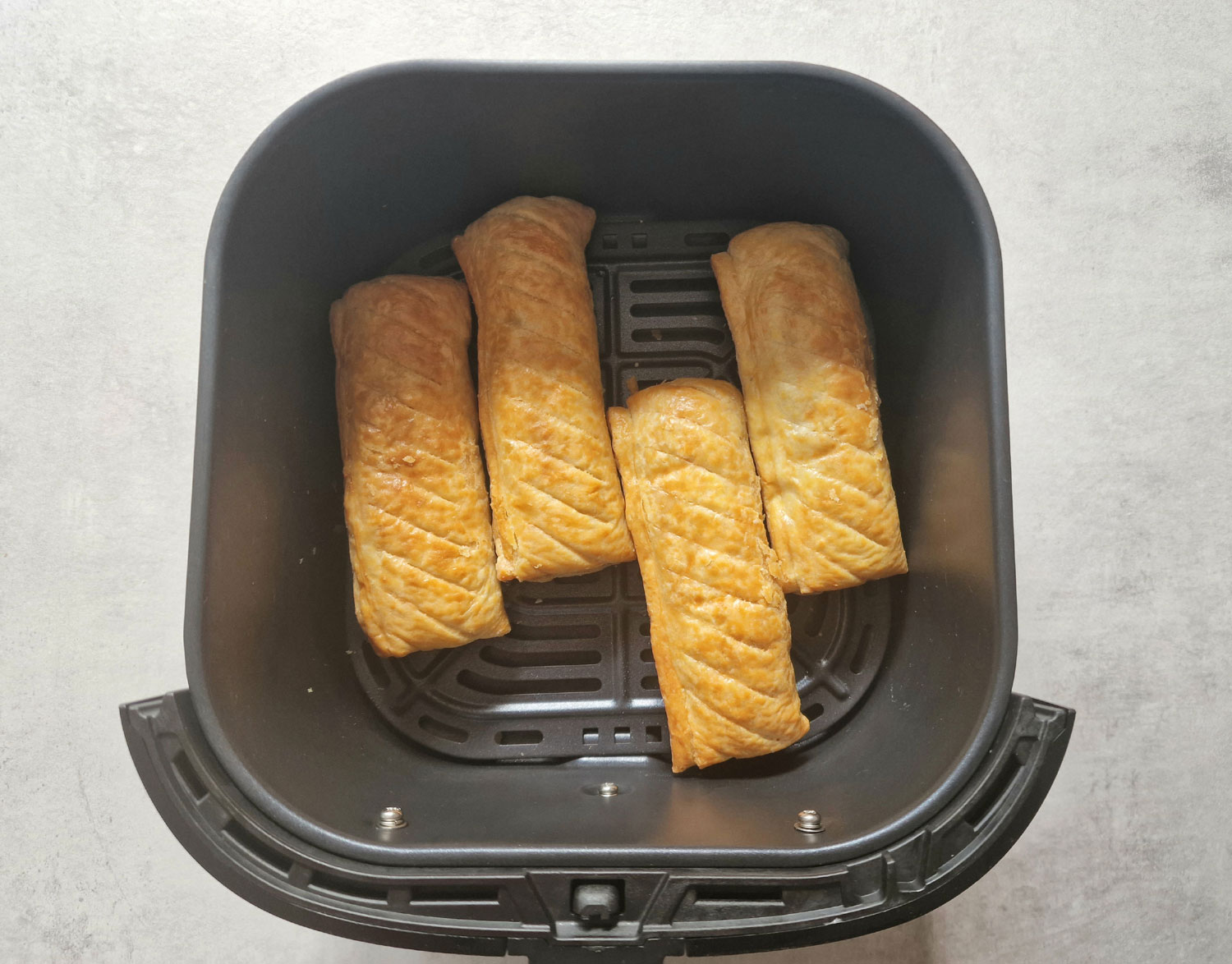 cooked frozen sausage rolls in an air fryer