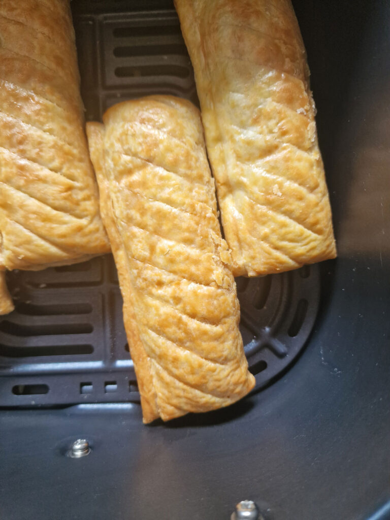 cooked sausage rolls in air fryer basket