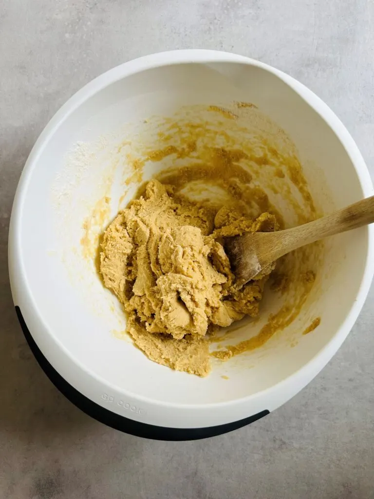 cookie dough with wooden spoon