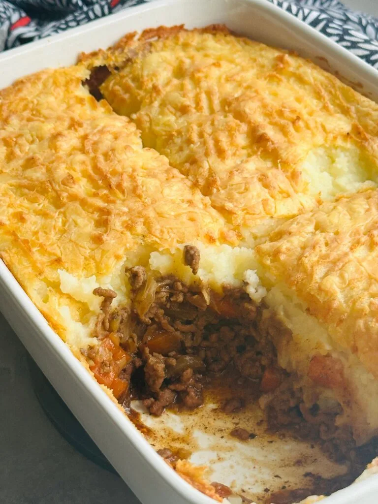 cottage pie up close with a portion removed