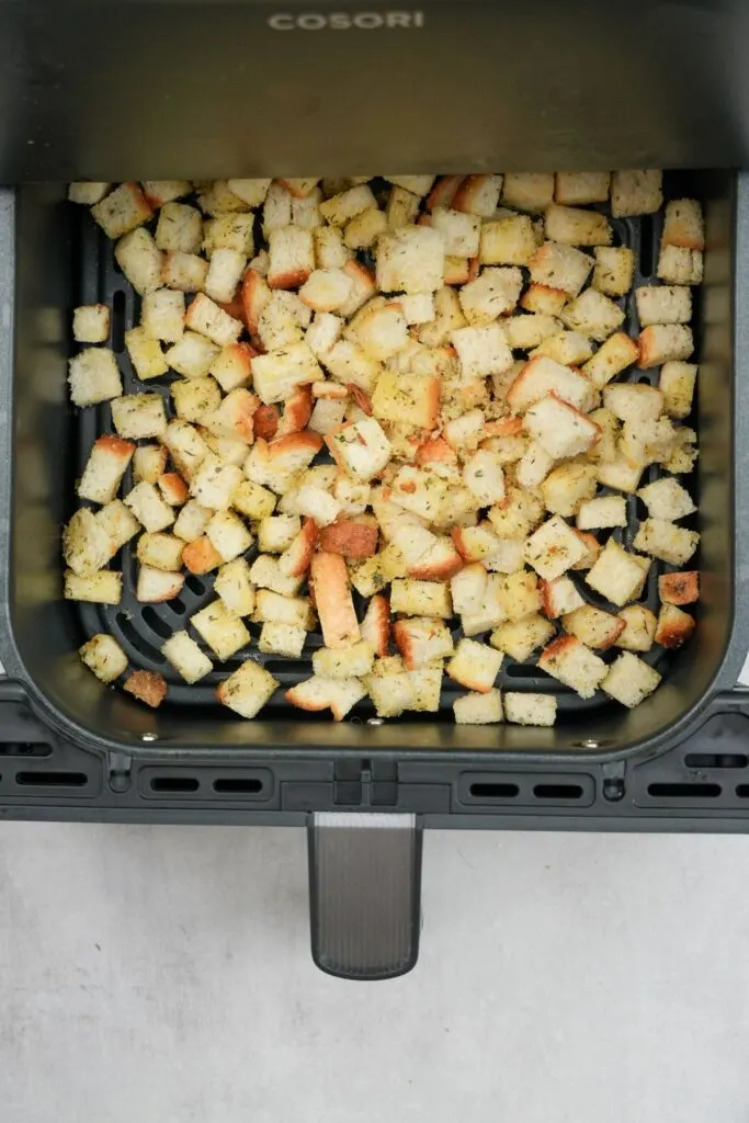 croutons in air fryer ready to cook