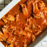 slow cooker curried pulled pork in a serving bowl