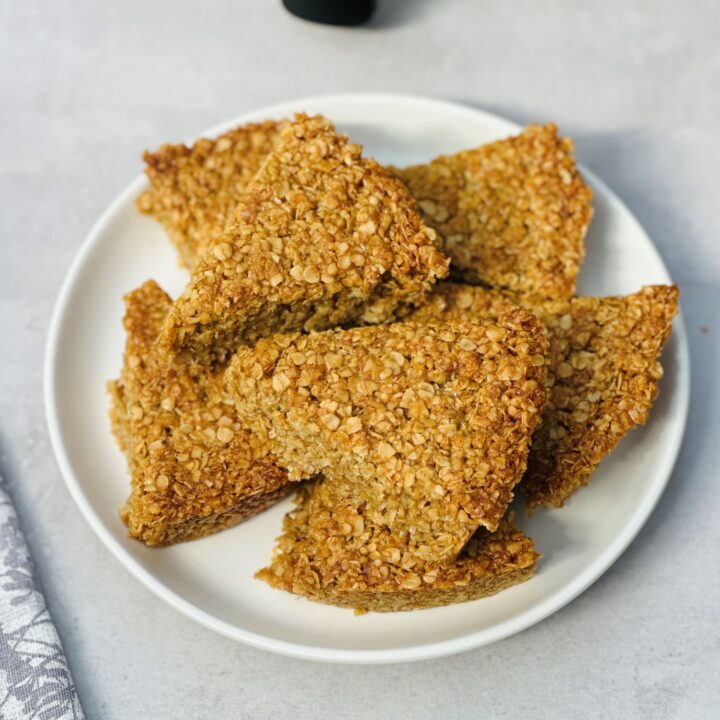 sliced flapjacks on a white plate next to an air fryer