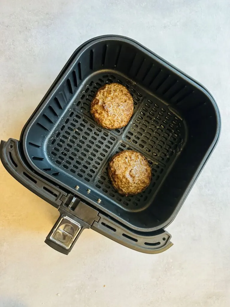 frozen burgers cooking in air fryer