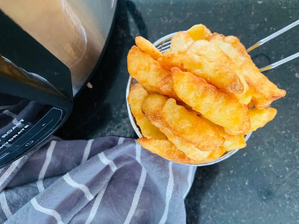 air fryer frozen chips cooked next to Ninja Foodi