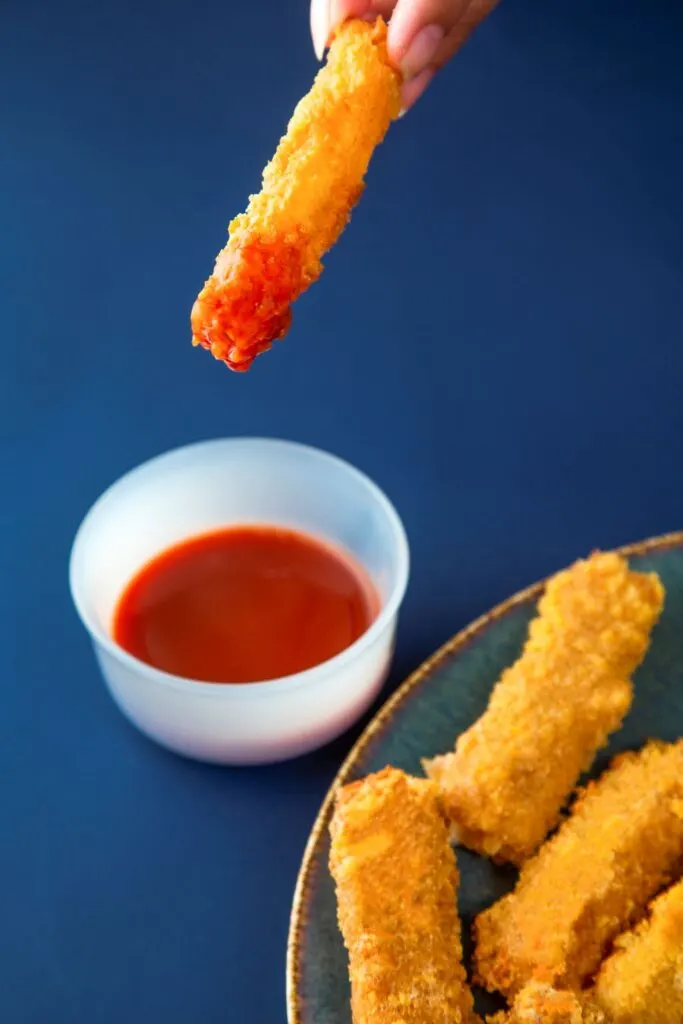 dipping halloumi fry in sauce