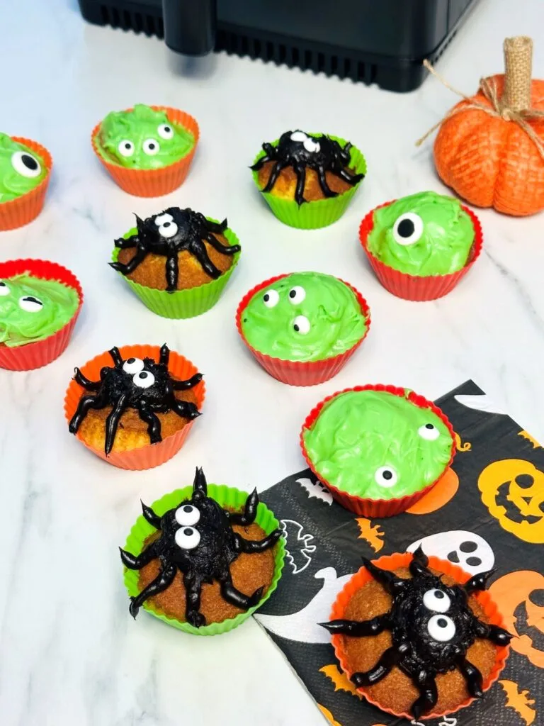 Halloween cupcakces next to an air fryer