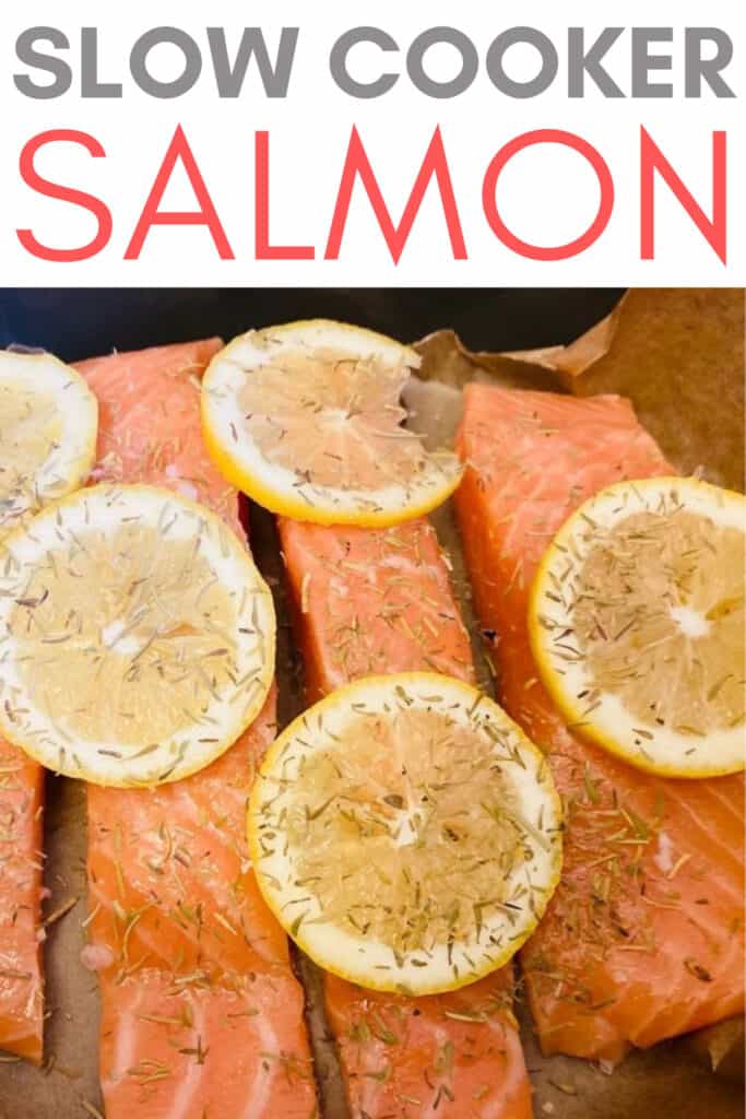 4 pieces of raw salmon in a slow cooker with herbs and lemons on top