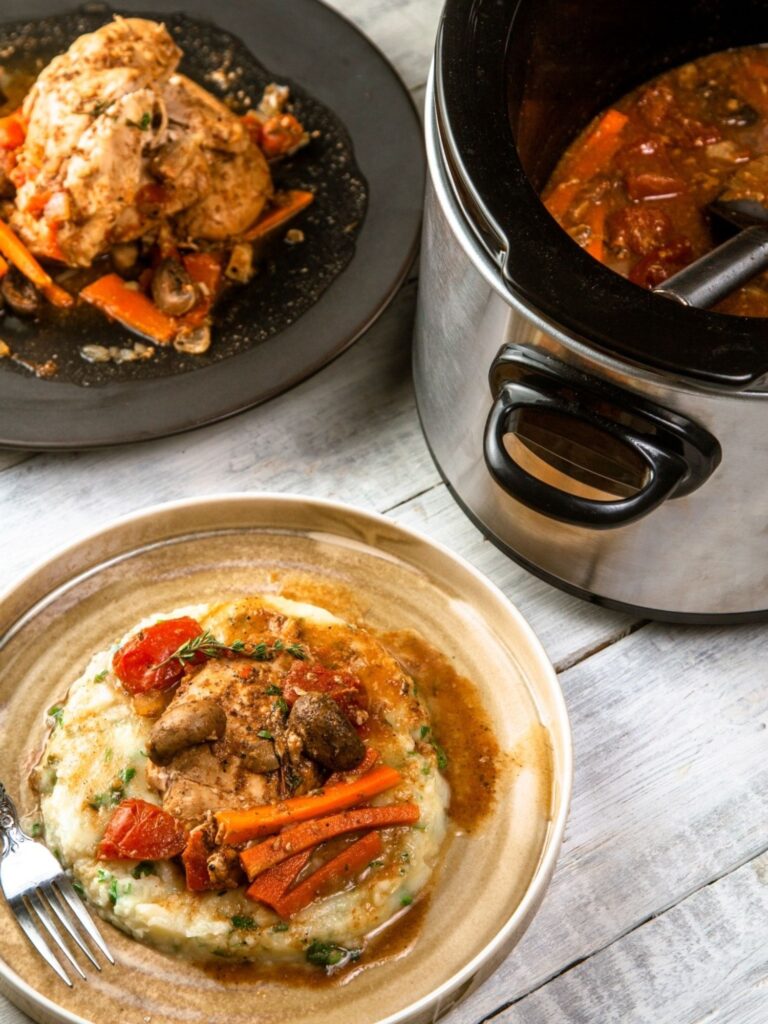 slow cooker with a finished dish next to it