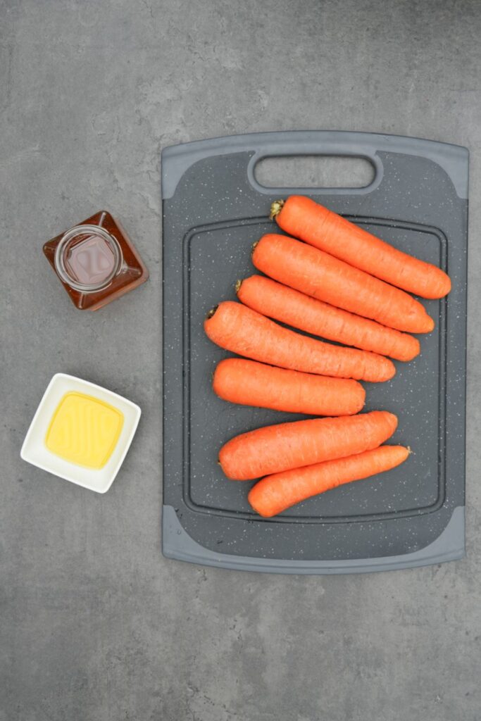 ingredients for roasting carrots in an air fryer: 7 carrots, honey and oil