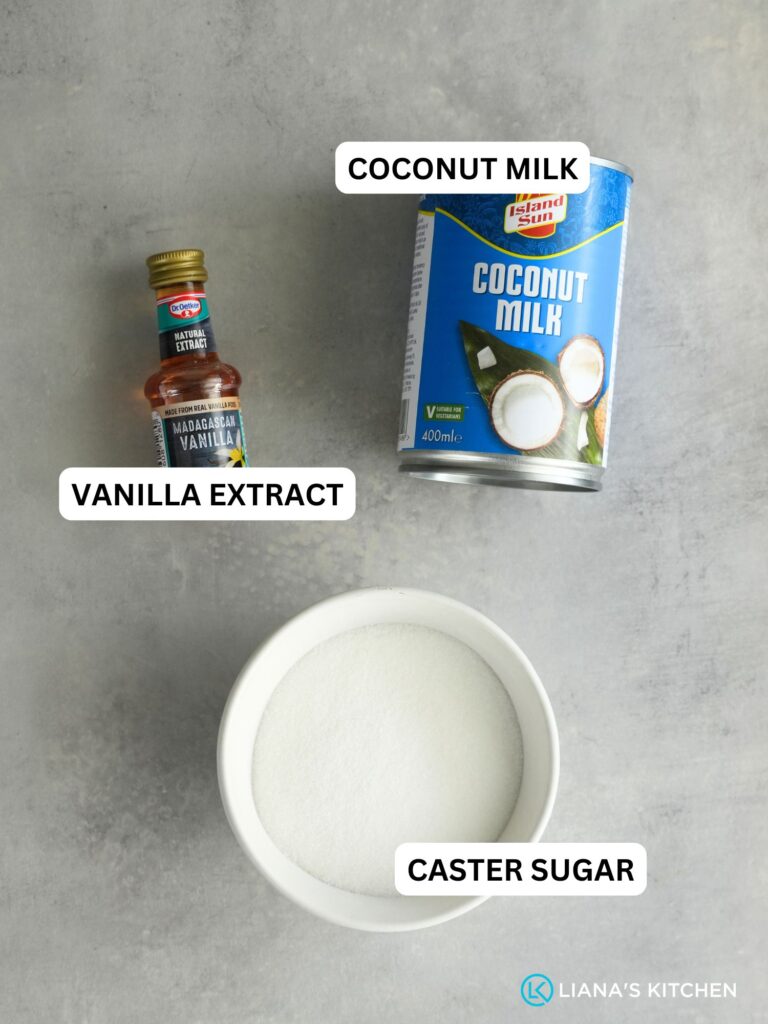 ingredients laid out for dairy free coconut ice cream: vanilla extract, coconut milk and caster sugar