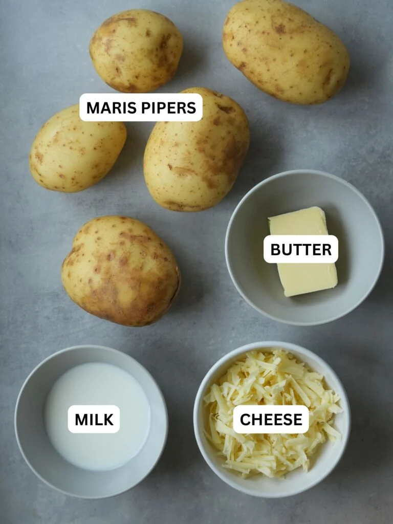 ingredients laid out and labelled for mashed potatoes: maris pipers, butter, milk and cheese