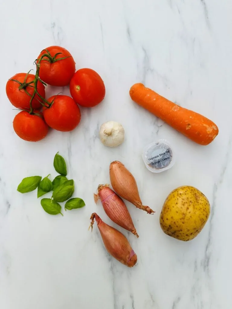 ingredients for tomato and basil soup in a soup maker