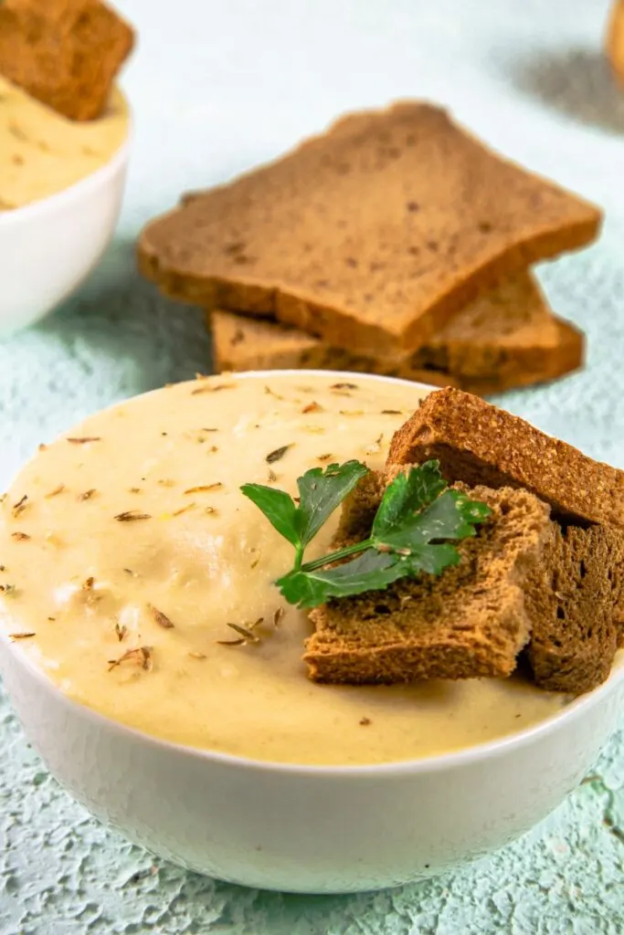 leek and potato soup in bowls, served from slow cooker.