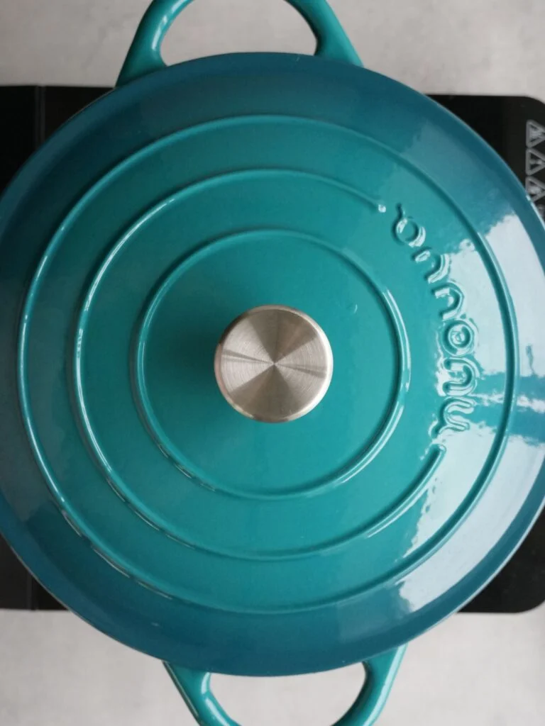 lid on dutch oven while cooking sausage casserole