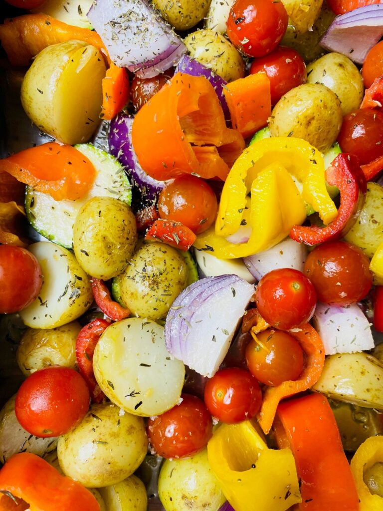 chopped vegetables ready to be put in the oven for a mediterranean vegetable roast