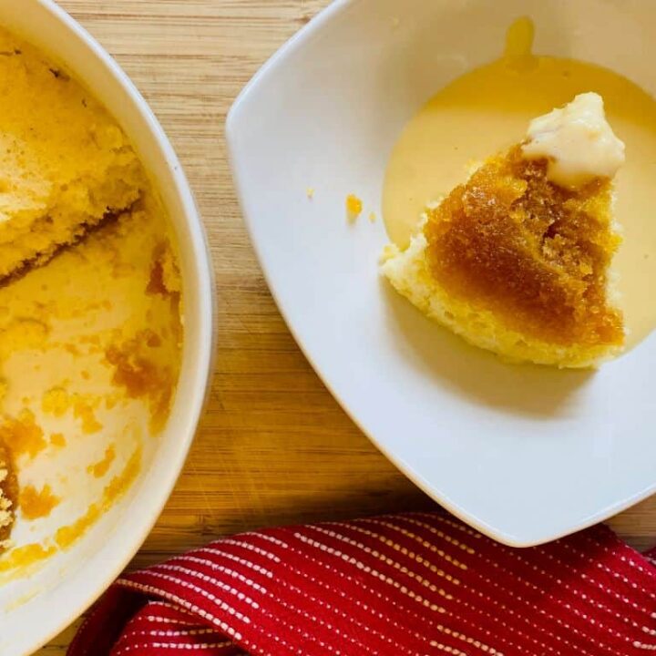 portion of microwave treacle sponge with custard poured on top
