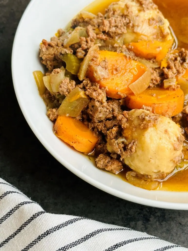 mince and dumplings on plate