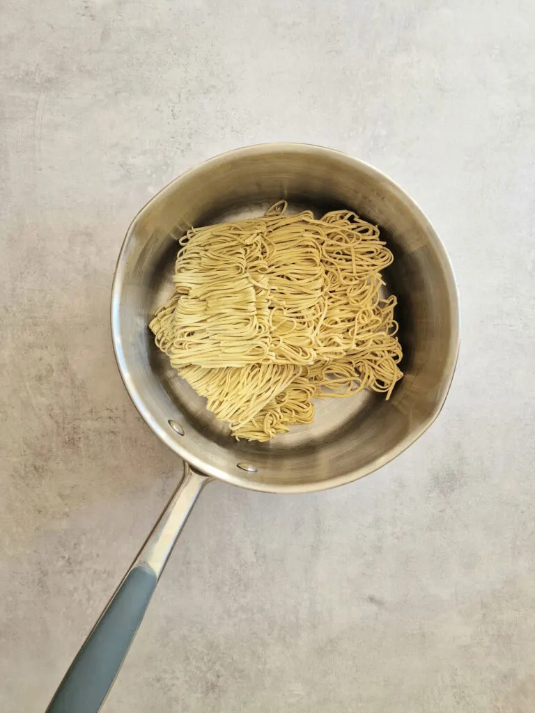 dried noodles in saucepan