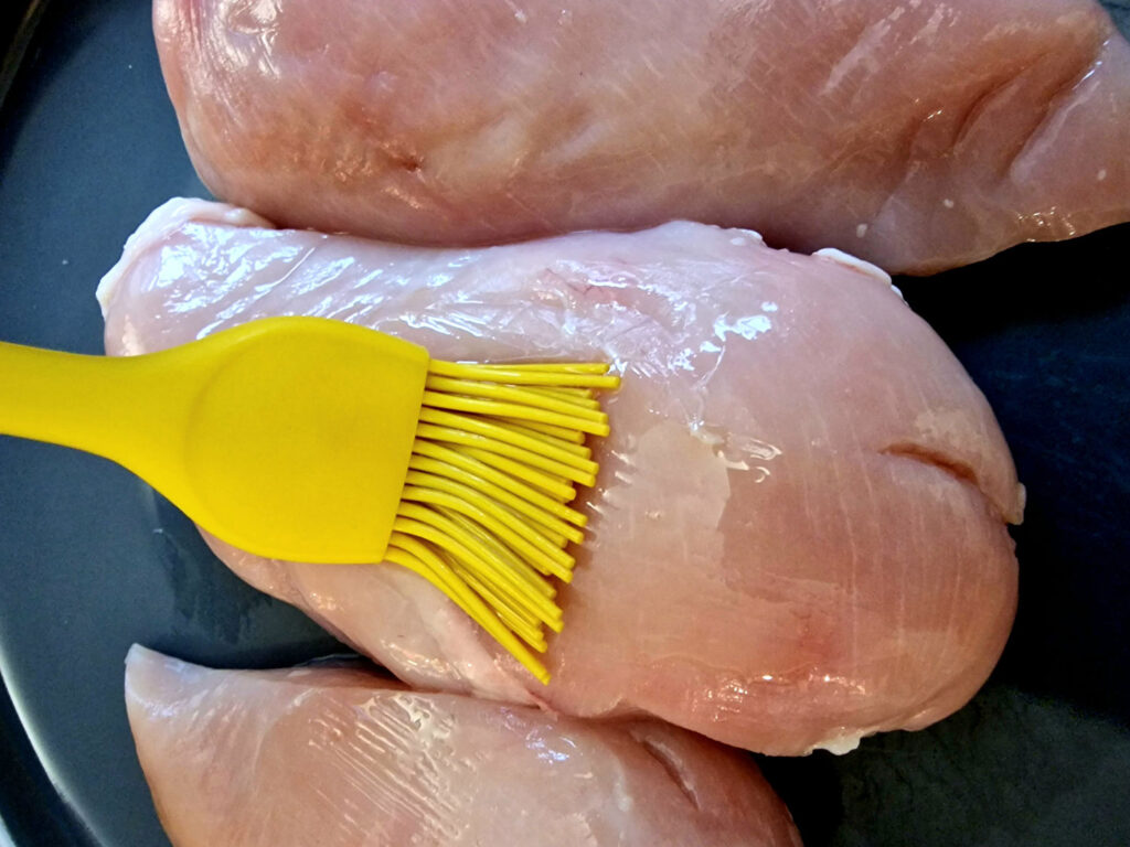 oiling chicken breasts before adding them to the air fryer