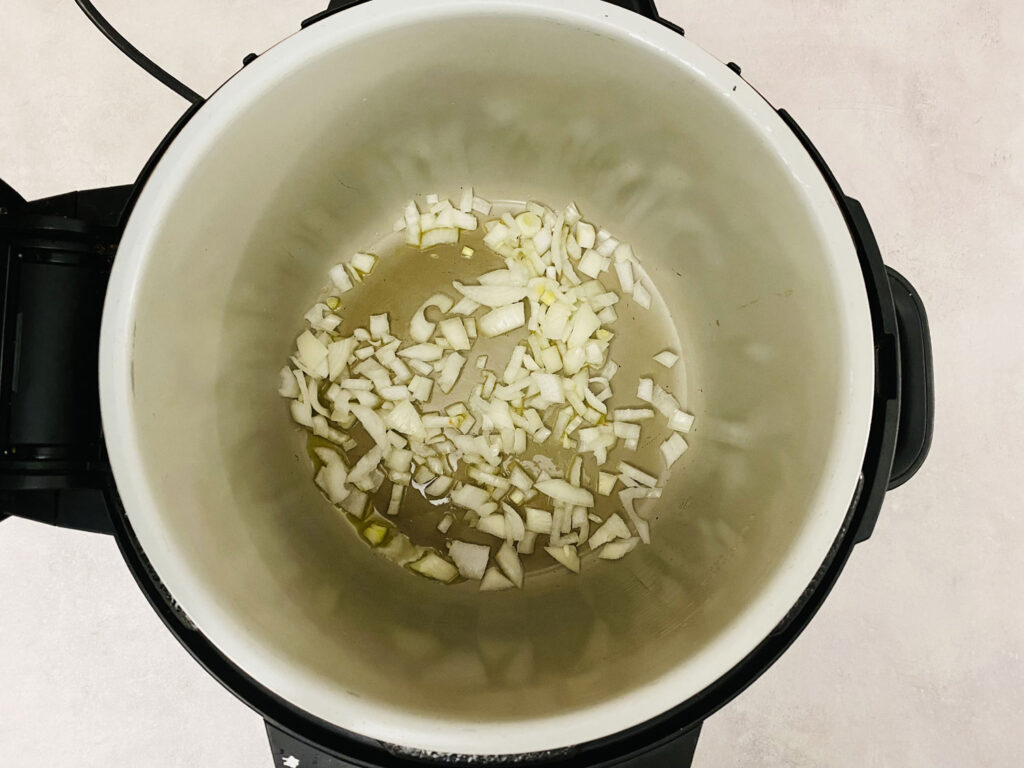 sauteeing the onion in the Ninja Foodi