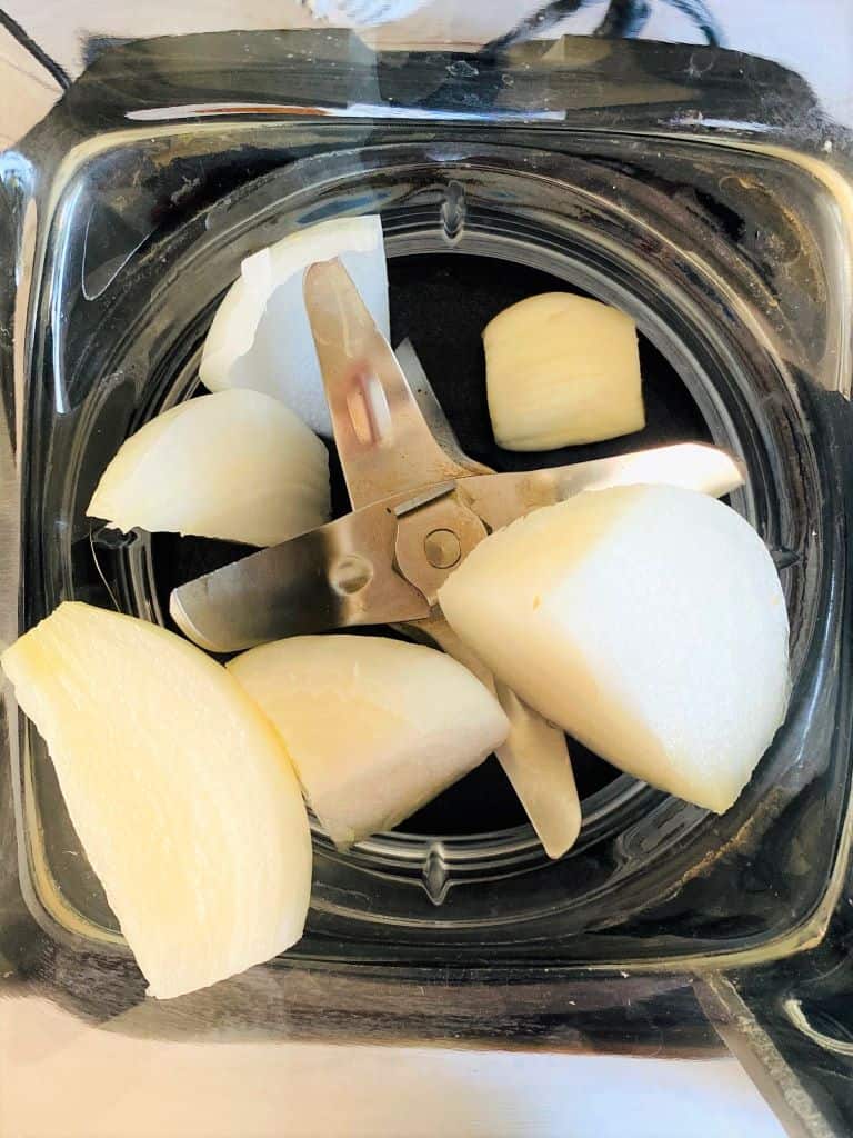 raw onions and garlic clove in the Ninja Soup Maker