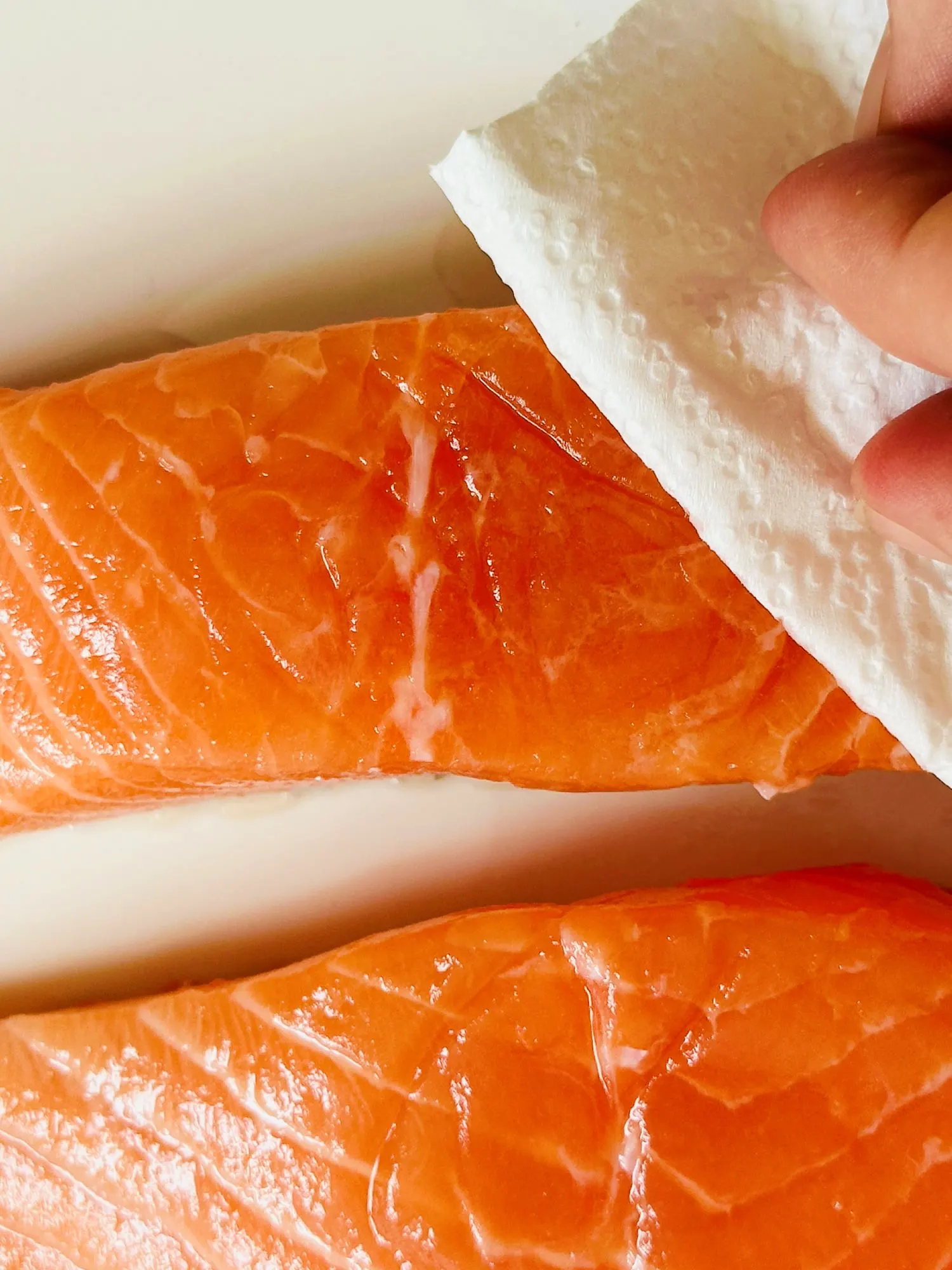 patting a salmon fillet dry for air fryer