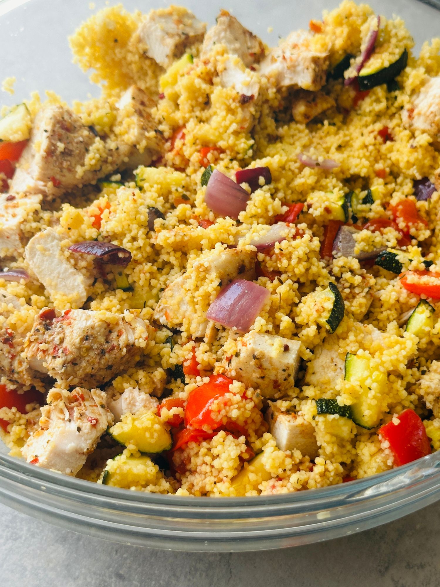 piri piri chicken mixed in with roasted vegetables and couscous
